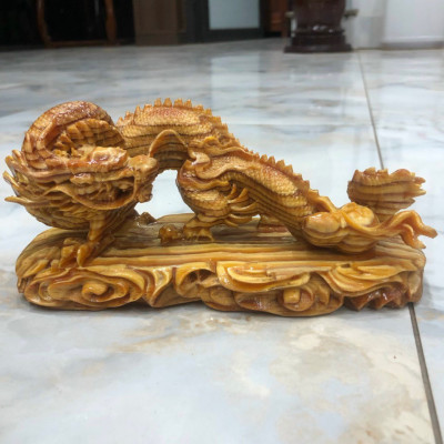Tượng con rồng phong thủy cầu tài lộc bằng gỗ huyết long kt 20×10×8cm