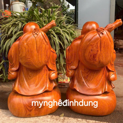 Tượng phật di lặc dắt cò bằng gỗ hương đá cao 40cm