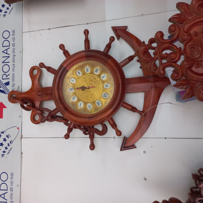 Đồng hồ mỏ leo treo tường bằng gỗ hương kt 85×60×10cm